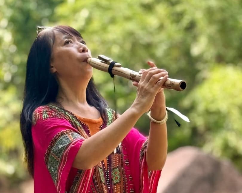 Kendra playing a Native American flute